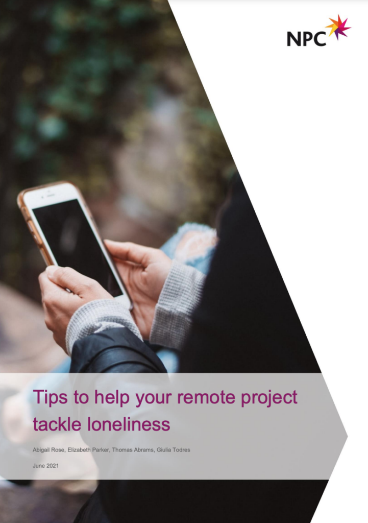 Front page of the guide, with text that says 'Tips to help your remote project tackle loneliness'. The image is a photo of a person holding a mobile phone.