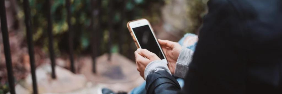 Close-up of a person holding a mobile phone.