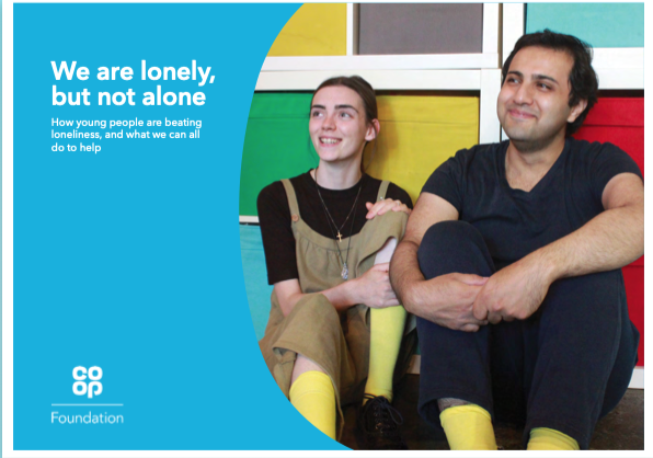 Report front page that says 'We are lonely, but not alone. How young people are beating loneliness, and what we can all do to help.' The image shows a young woman and man sitting on the floor and smiling, against a multi-coloured wall.