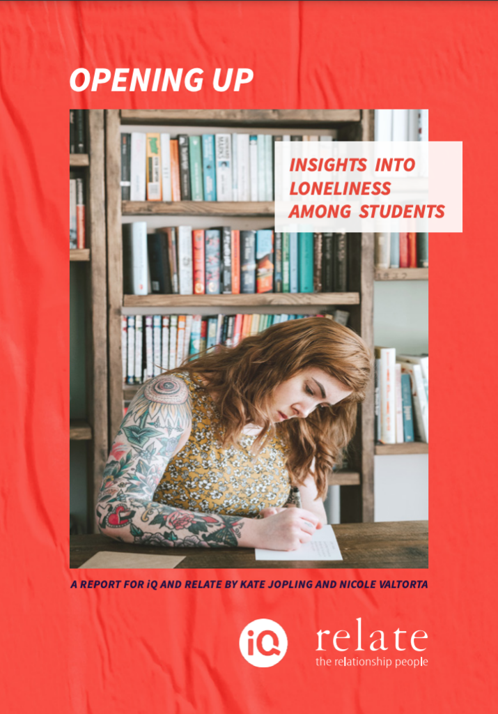 Front page of the report that says 'Opening up: Insights into loneliness among students'. The image is a photo of a young woman writing at a desk.