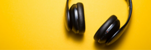 Headphones against a yellow background.