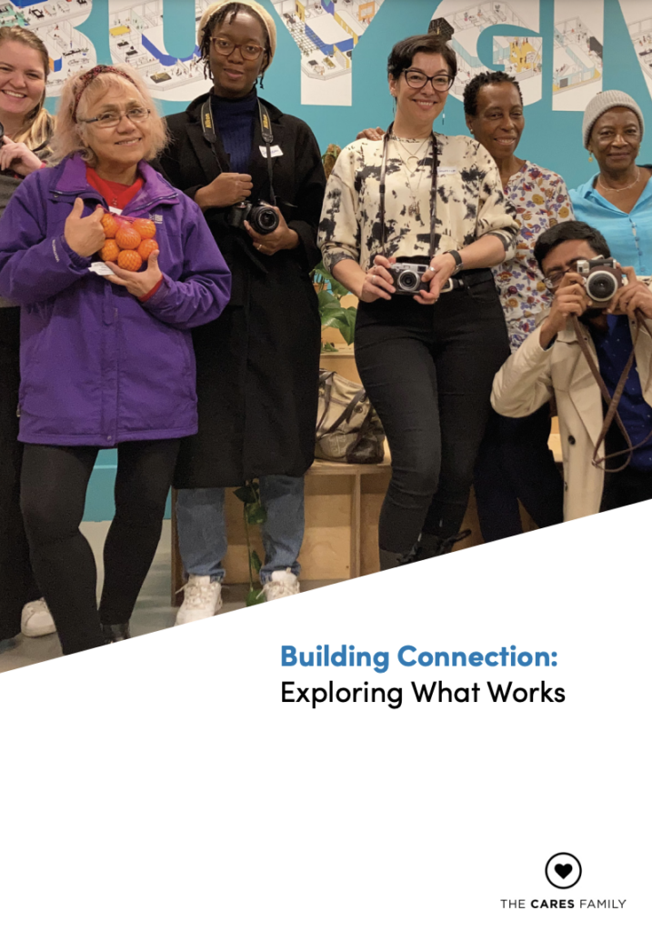 Front page of the report. The text reads 'Building connections - exploring what works' and their is an image of seven younger and older people standing together and smiling at the camera.