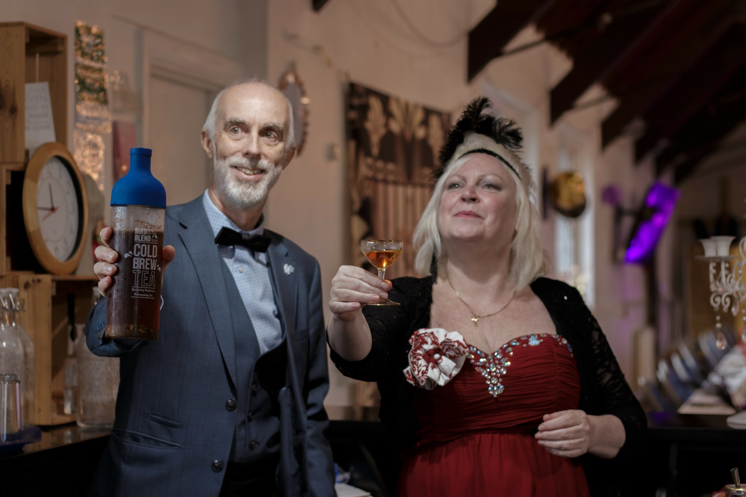 A man and woman dressed in evening wear for a Glamour Club events.